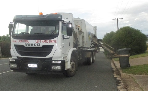 Council's garbage truck collecting a garbage bin